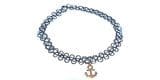 Choker with a lace pattern and a small gold anchor pendant in the center.