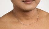 Close-up of a person wearing a 14k GP White Solid Gold Chain 3.4g against a bare chest and a white background.