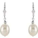 Sterling Silver 9-9.5 mm Cultured White Freshwater Pearl Earrings Item # 651654 with silver hooks and small decorative elements above the pearls.