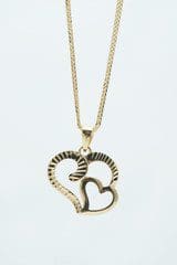 An 18K Yellow-Gold Heart-Design Necklace 18 Inches L with a gold double heart design hanging from a gold chain.