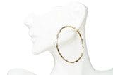 Side view of a white mannequin head wearing 18k Gold Hoop Earrings 2 Inches.