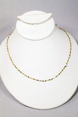 A 14k Gold Plated Chain displayed on a white mannequin bust.